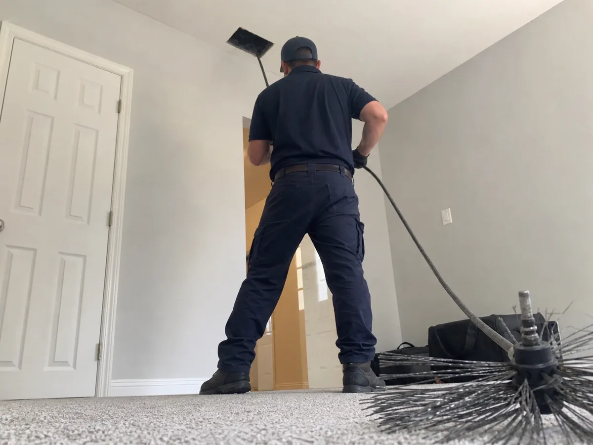 air duct cleaning technician on the job in San Jose, CA